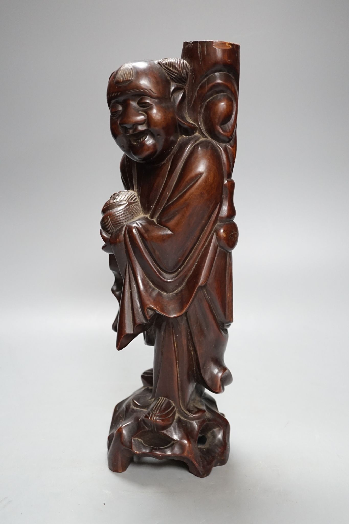 A Chinese hardwood figure of an immortal, 36cm